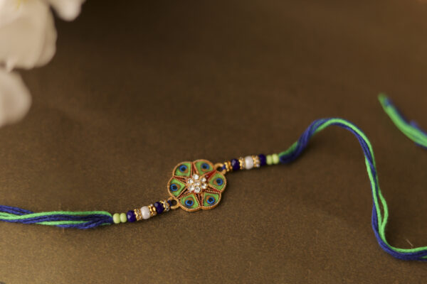 Peacock Feather Designer Rakhi with Stone Centerpiece