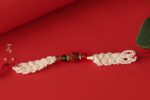 Sacred Rudraksha Rakhi with Pearl Braiding