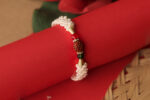 Sacred Rudraksha Rakhi with Pearl Braiding