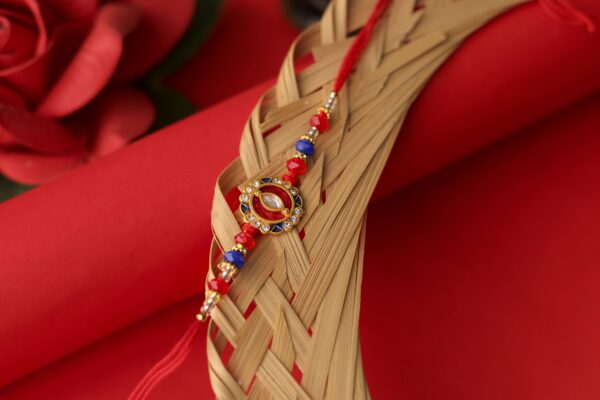 Royal Kundan Rakhi with Red & Blue Beads