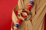 Royal Kundan Rakhi with Red & Blue Beads