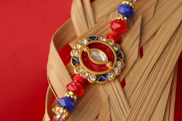 Royal Kundan Rakhi with Red & Blue Beads