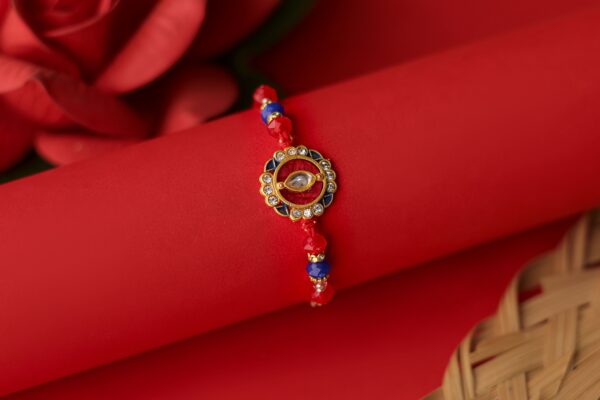 Royal Kundan Rakhi with Red & Blue Beads