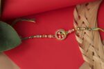 Peacock Feather Rakhi with Ganesha Charm