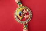 Peacock Feather Rakhi with Ganesha Charm