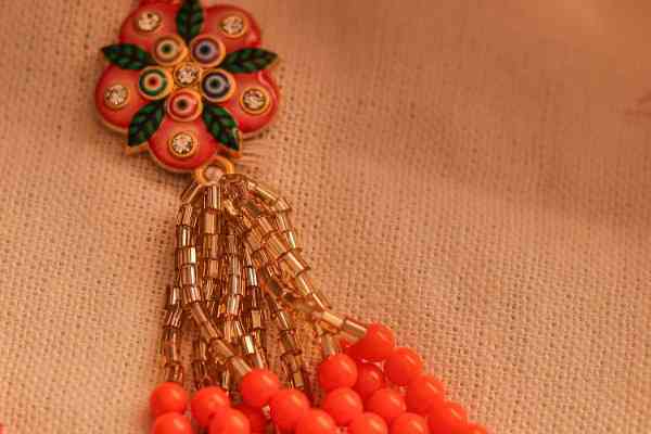 Vibrant Orange Bhaiya Bhabhi Rakhi Pair