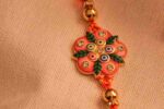 Vibrant Orange Bhaiya Bhabhi Rakhi Pair