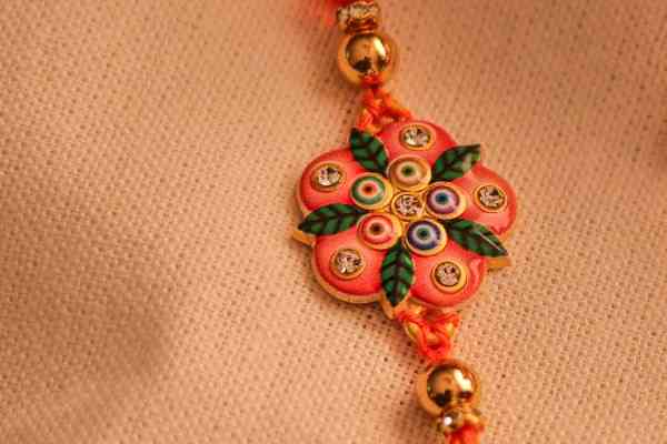Vibrant Orange Bhaiya Bhabhi Rakhi Pair