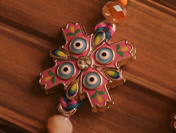 Nazar Suraksha Bhaiya-Bhabhi Rakhi Set by UtsavArts – Vibrant Protection, Handcrafted with Love