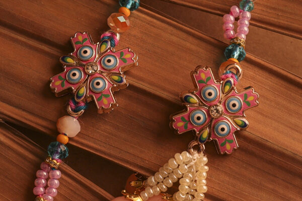 Nazar Suraksha Bhaiya-Bhabhi Rakhi Set by UtsavArts – Vibrant Protection, Handcrafted with Love