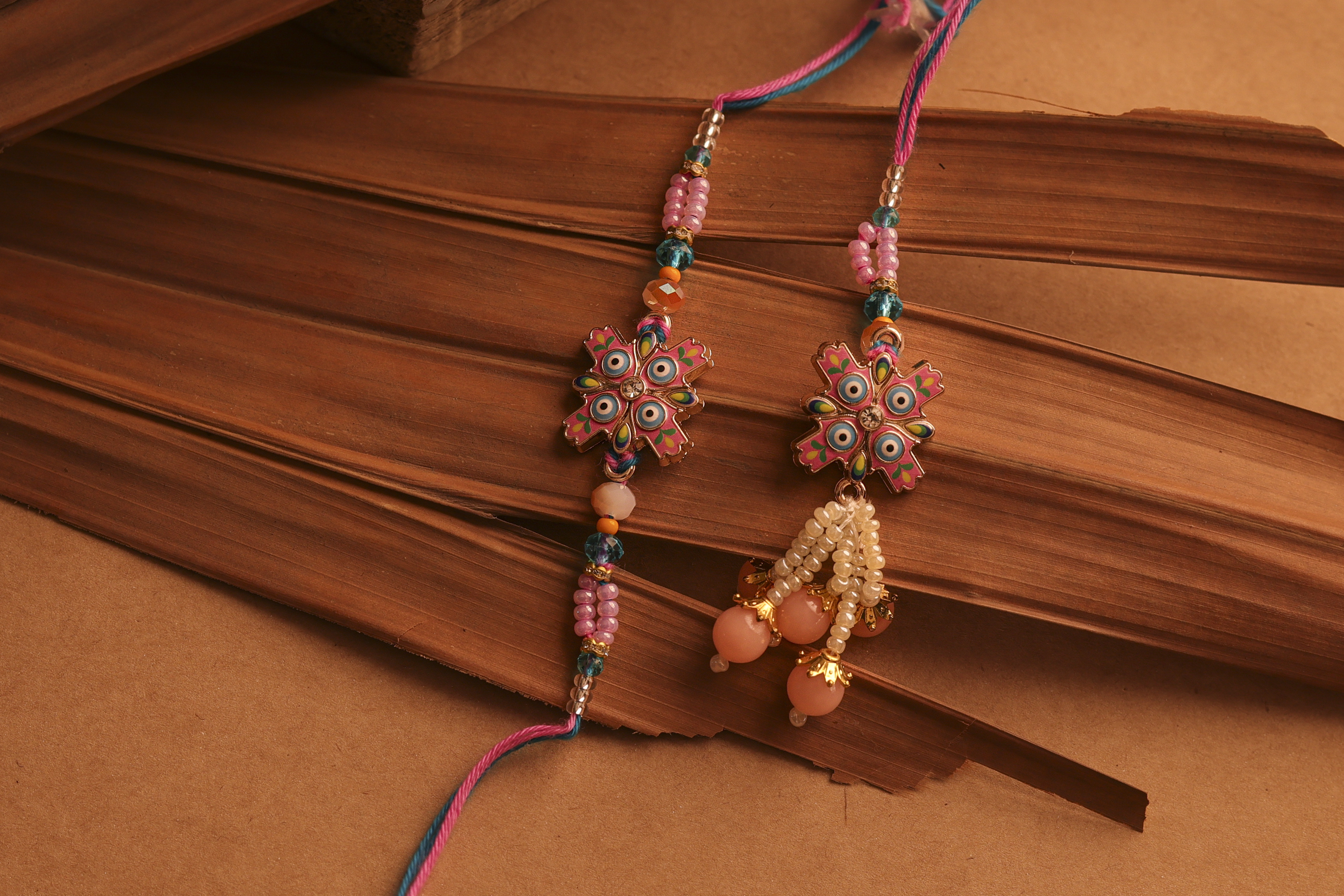 Nazar Suraksha Bhaiya-Bhabhi Rakhi Set by UtsavArts – Vibrant Protection, Handcrafted with Love